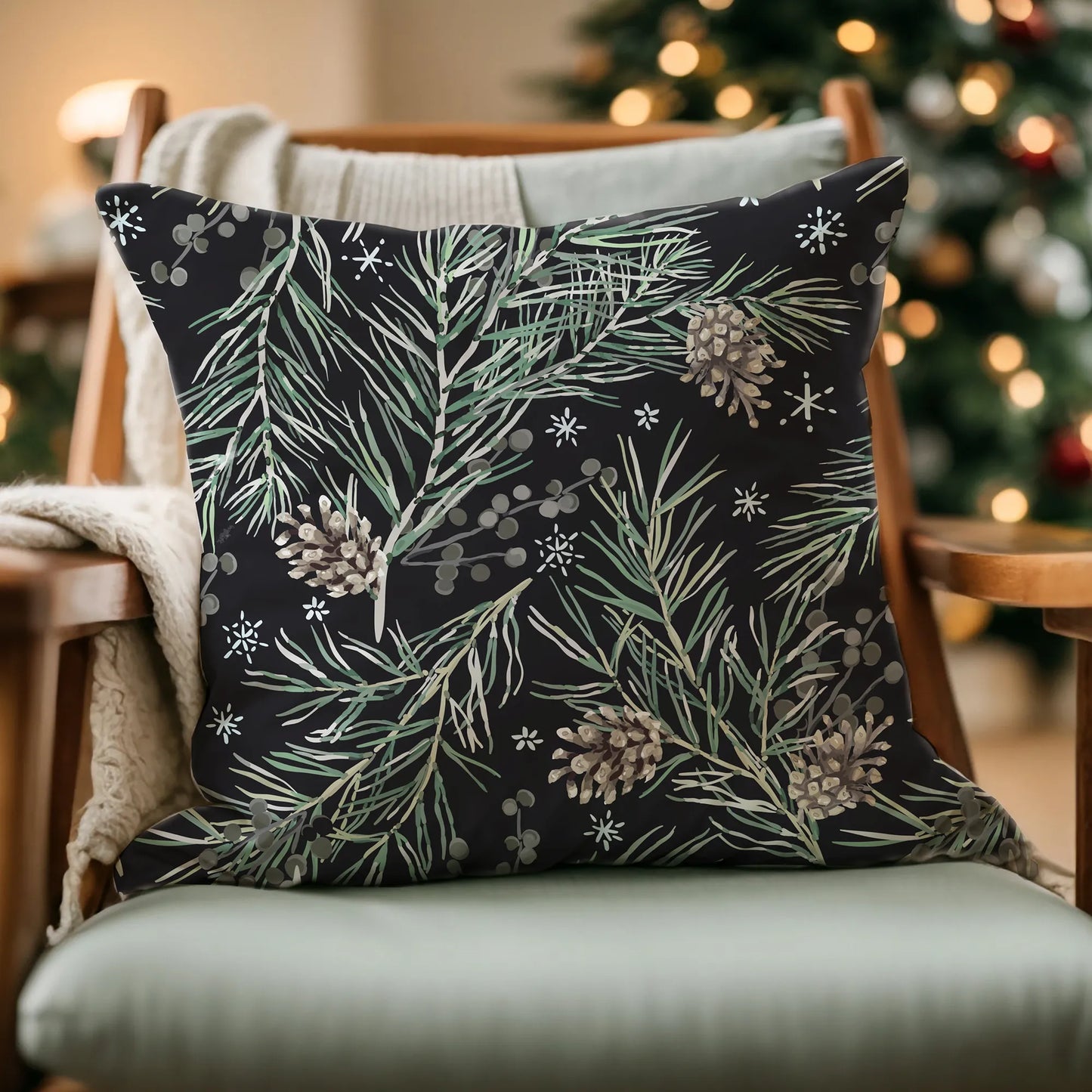 Green Winter Pine PILLOW from Blue Water Songs on the chair with christmas tree behind