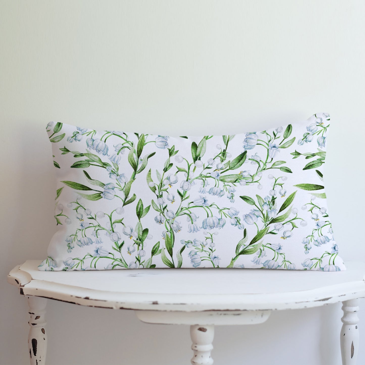 Watercolor Lily of The Valley Flowers lumbar PILLOW from Blue Water Songs on white vintage table