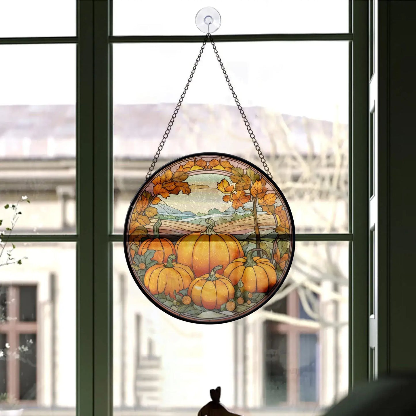 window decorated with pumpkin hanging ornament