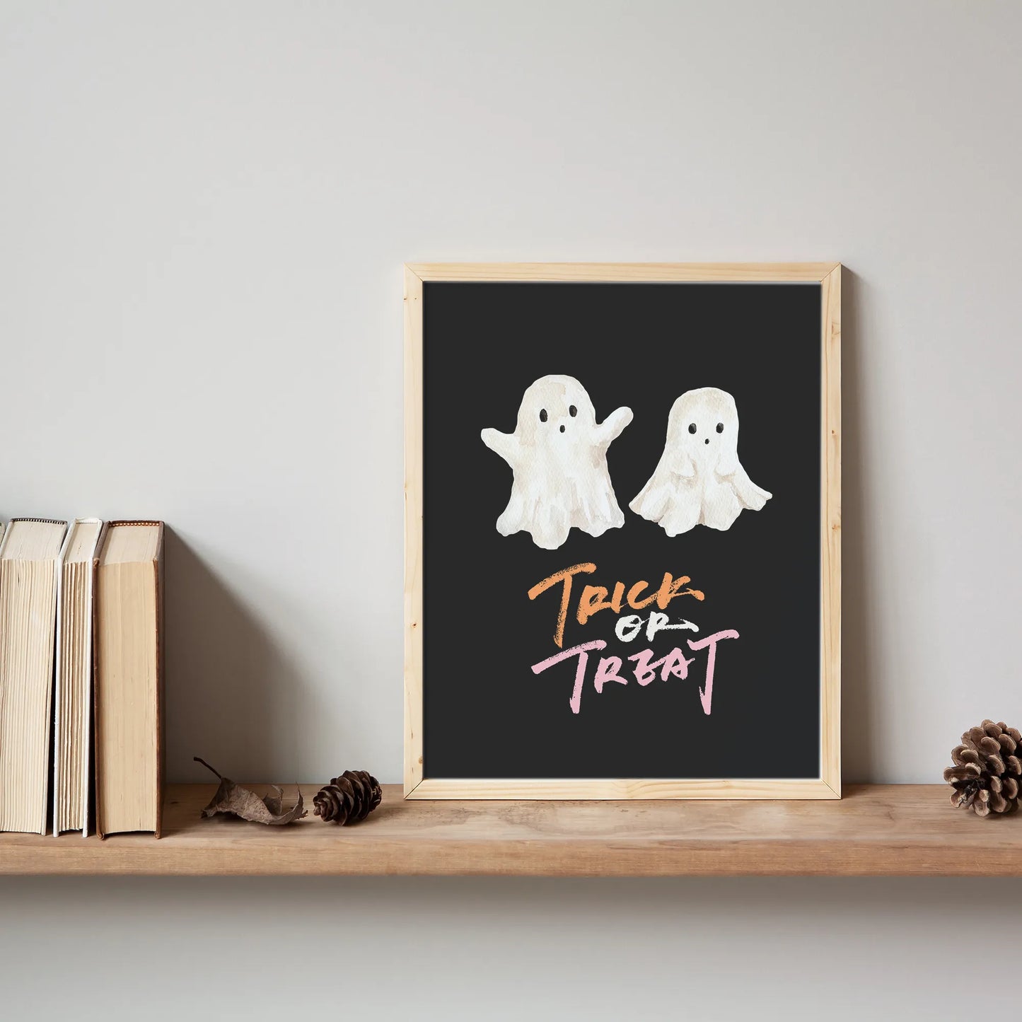 Trick or Treat Ghost Printable framed on minimalist wooden shelf for Halloween home decor