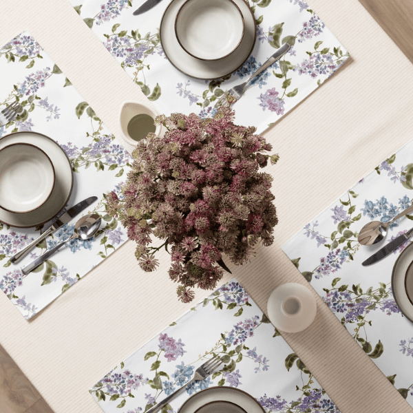Watercolor Lilac Flower PLACEMAT Set arranged on a table with dishes and flowers for a beautiful dining experience.