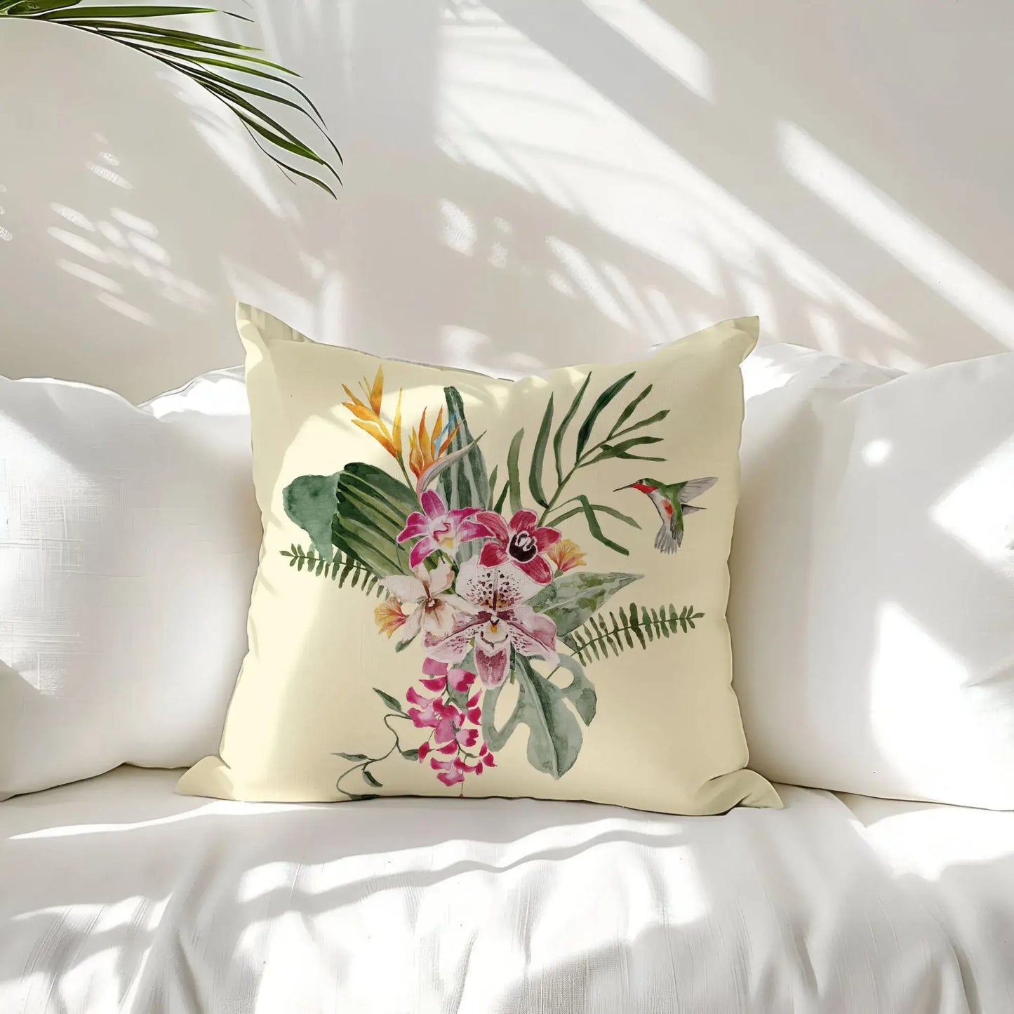 Watercolor Orchid & Hummingbird Pillow showcasing vibrant orchids and a hummingbird on a soft beige background.
