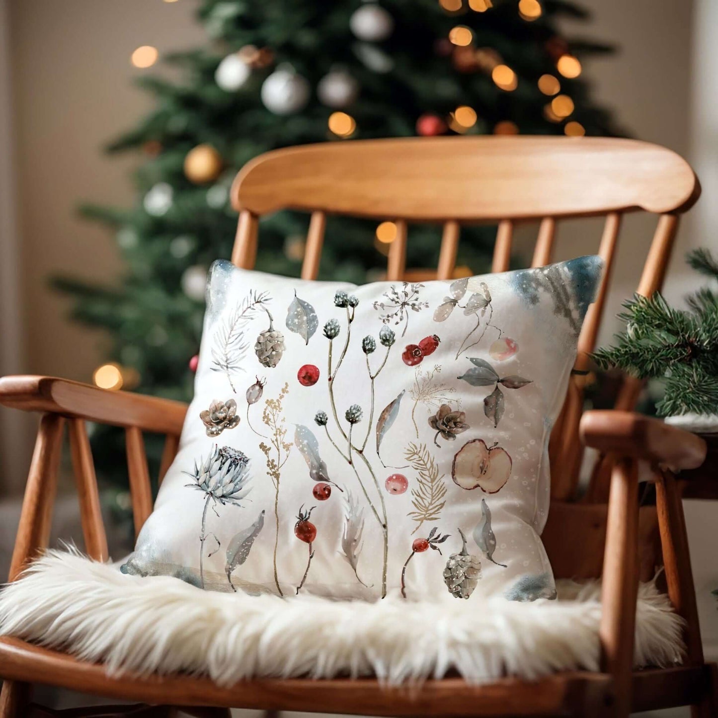 Winter Botanical Pillow Cover on a wooden chair with a cozy backdrop of a Christmas tree.