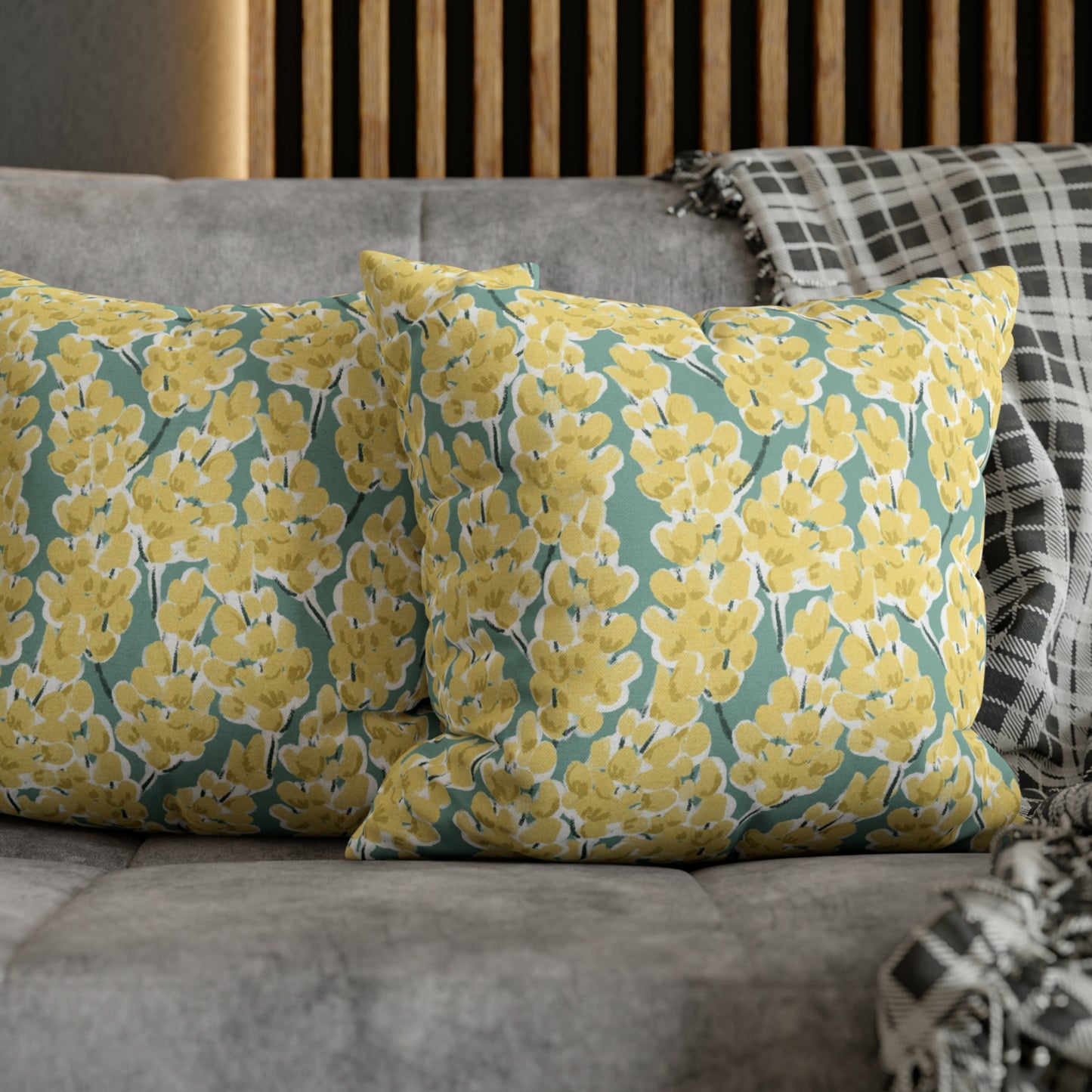 a close up of two pillows on a couch
