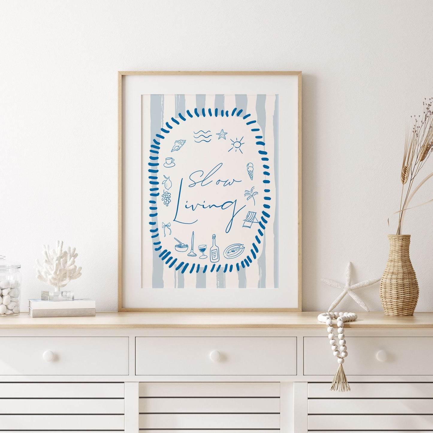 minimalist living room with poster slow living from Blue Water Songs