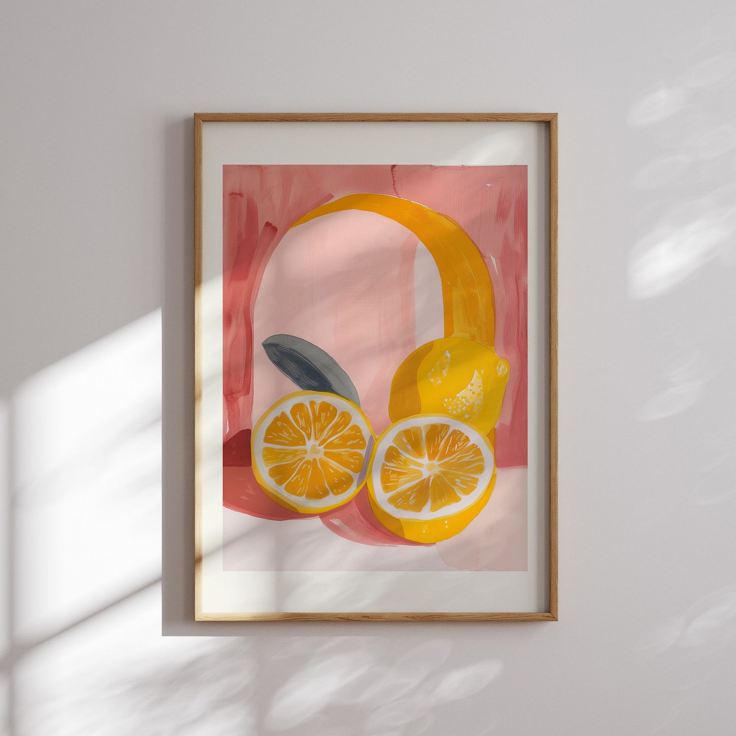 Framed lemon art print with sliced citrus and leaf on a soft pink background — digital summer wall decor with bold color and warm sunlight.