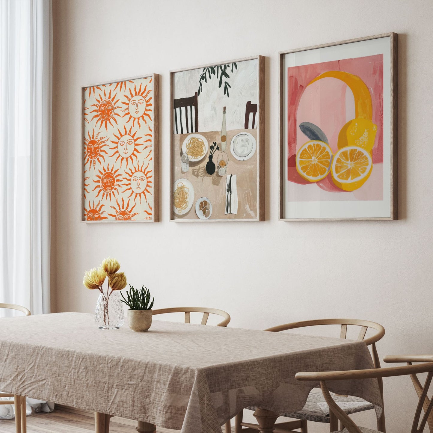 Three framed Italian-inspired art prints — sun motif, pasta dining still life, and citrus illustration — styled above a neutral dining table with natural light