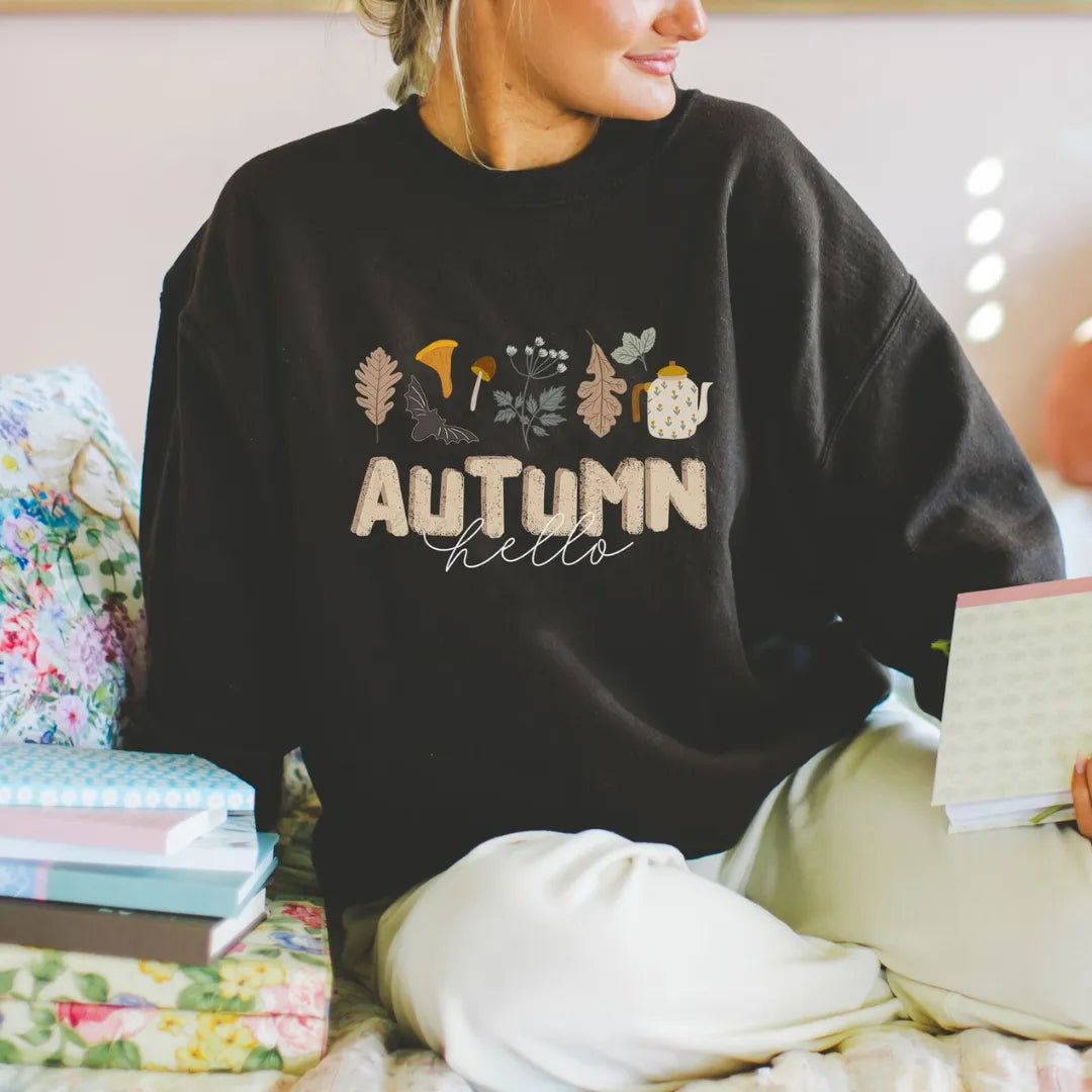 woman in Hello Autumn black SWEATSHIRT from Blue Water Songs