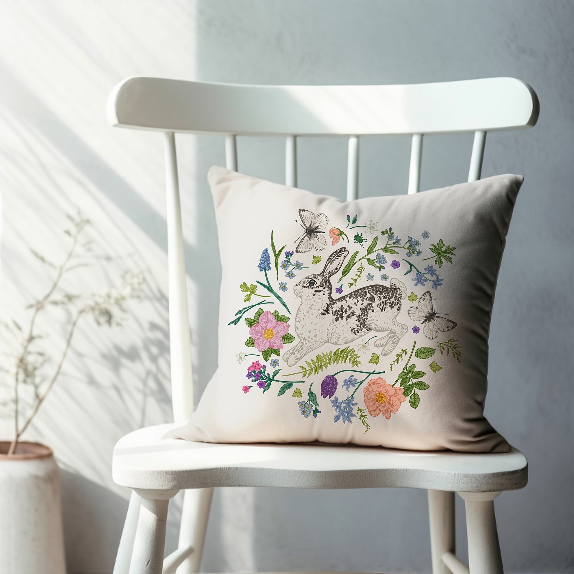 Bunny and Spring meadow PILLOW from Blue Water Songs on white chair 