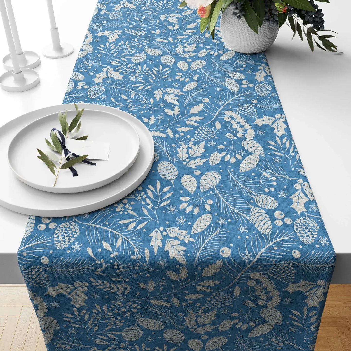 Blue Winter Botanical Christmas Table Runner featuring pine and berry designs on a blue background.