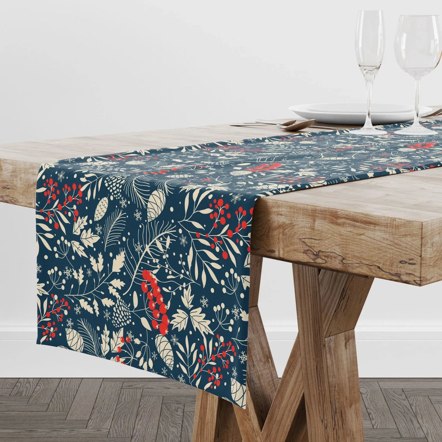 Blue Winter Botanical Christmas Table Runner featuring pine and berry design on a wooden dining table.