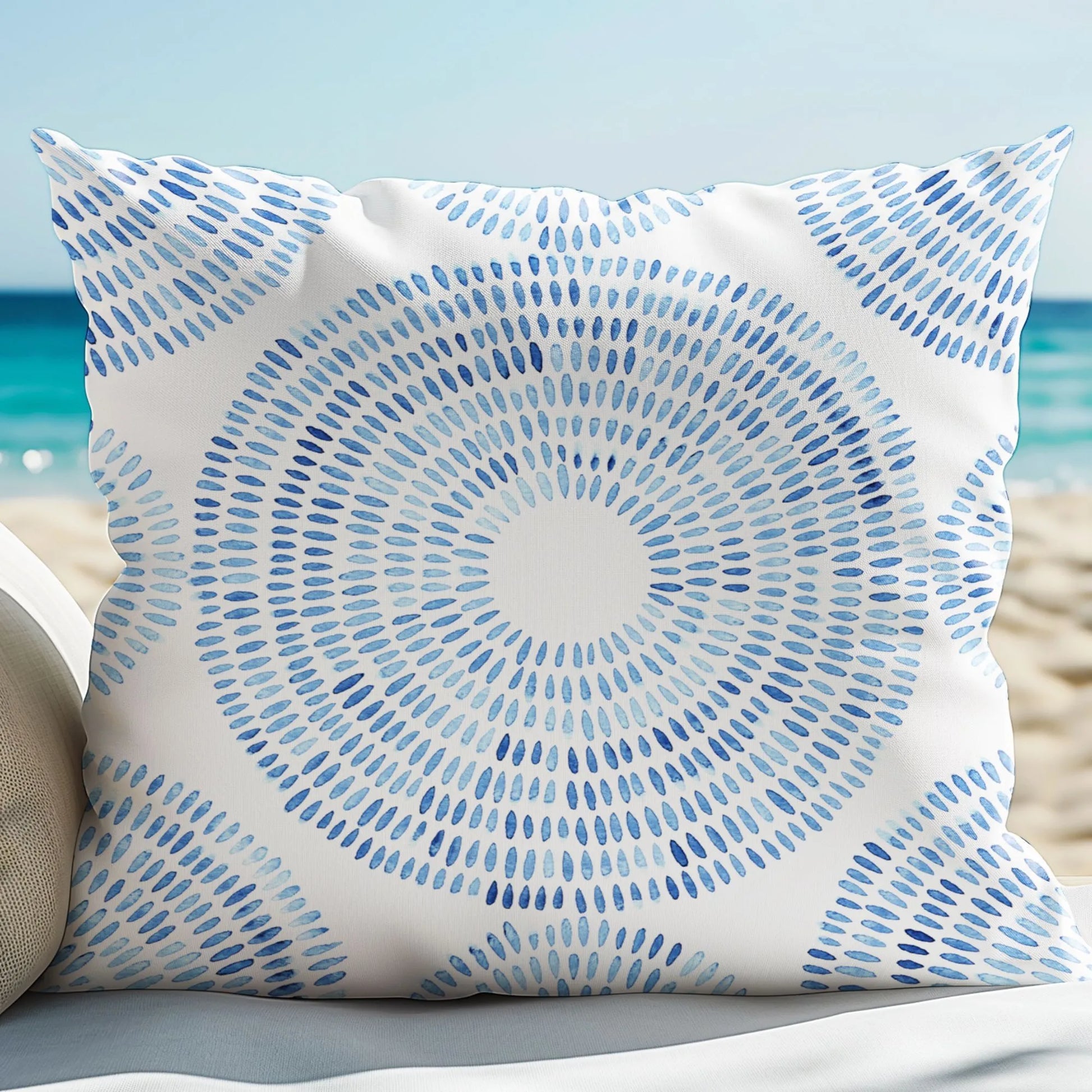 Blue Watercolor Hand-Painted Pattern| OUTDOOR PILLOW from Blue Water Songs sitting on beach