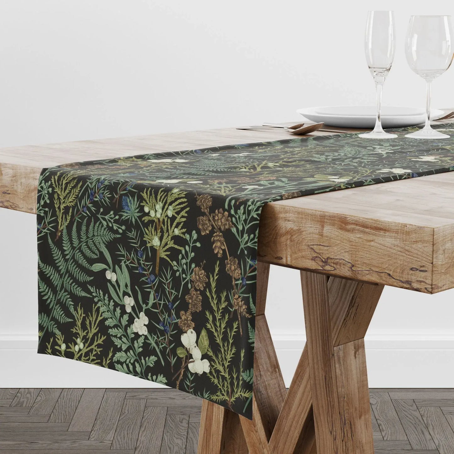 Botanical Christmas table runner showcased on a wooden table with elegant winter foliage and berries.