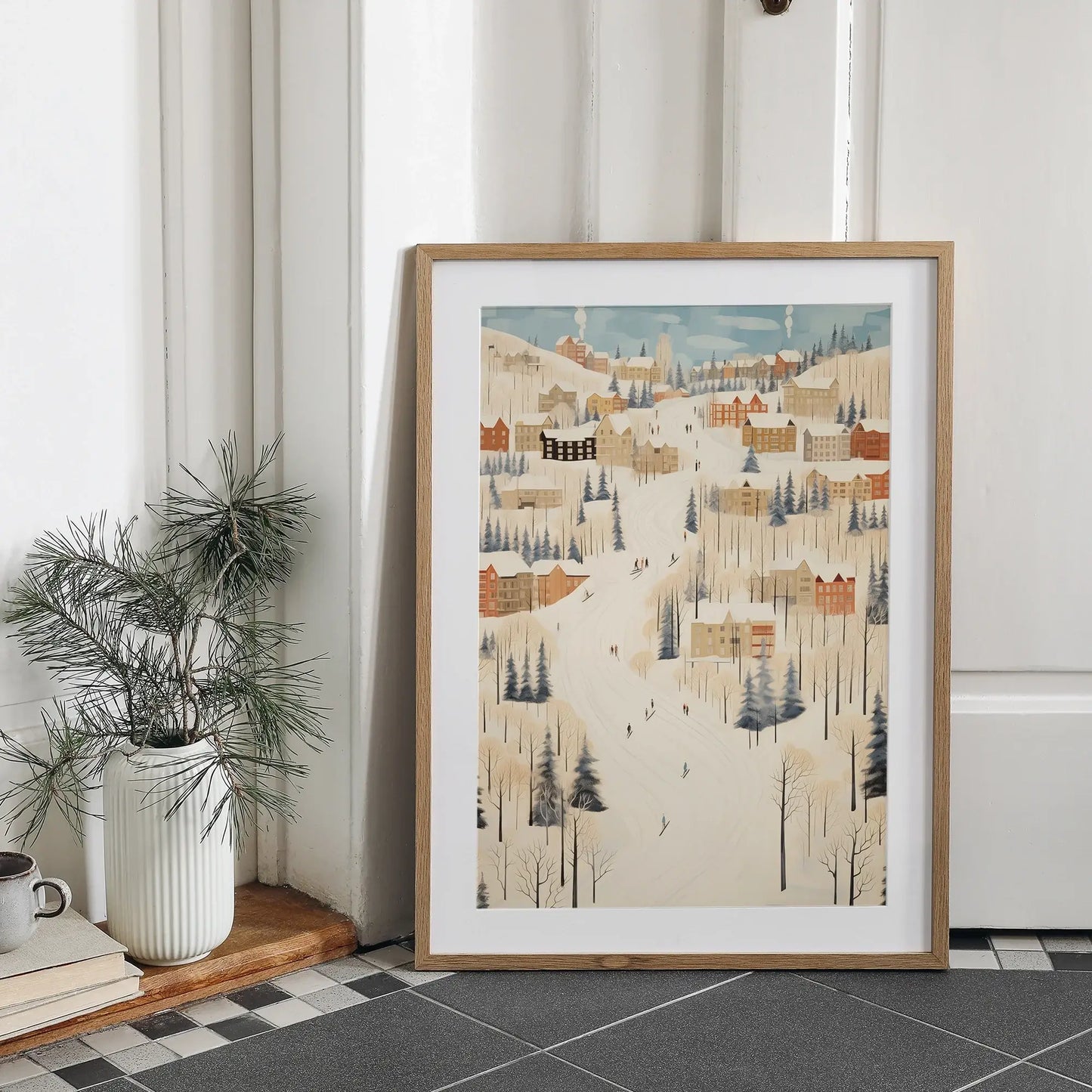 Christmas wall art prints featuring a winter village scene with snow and cozy homes.