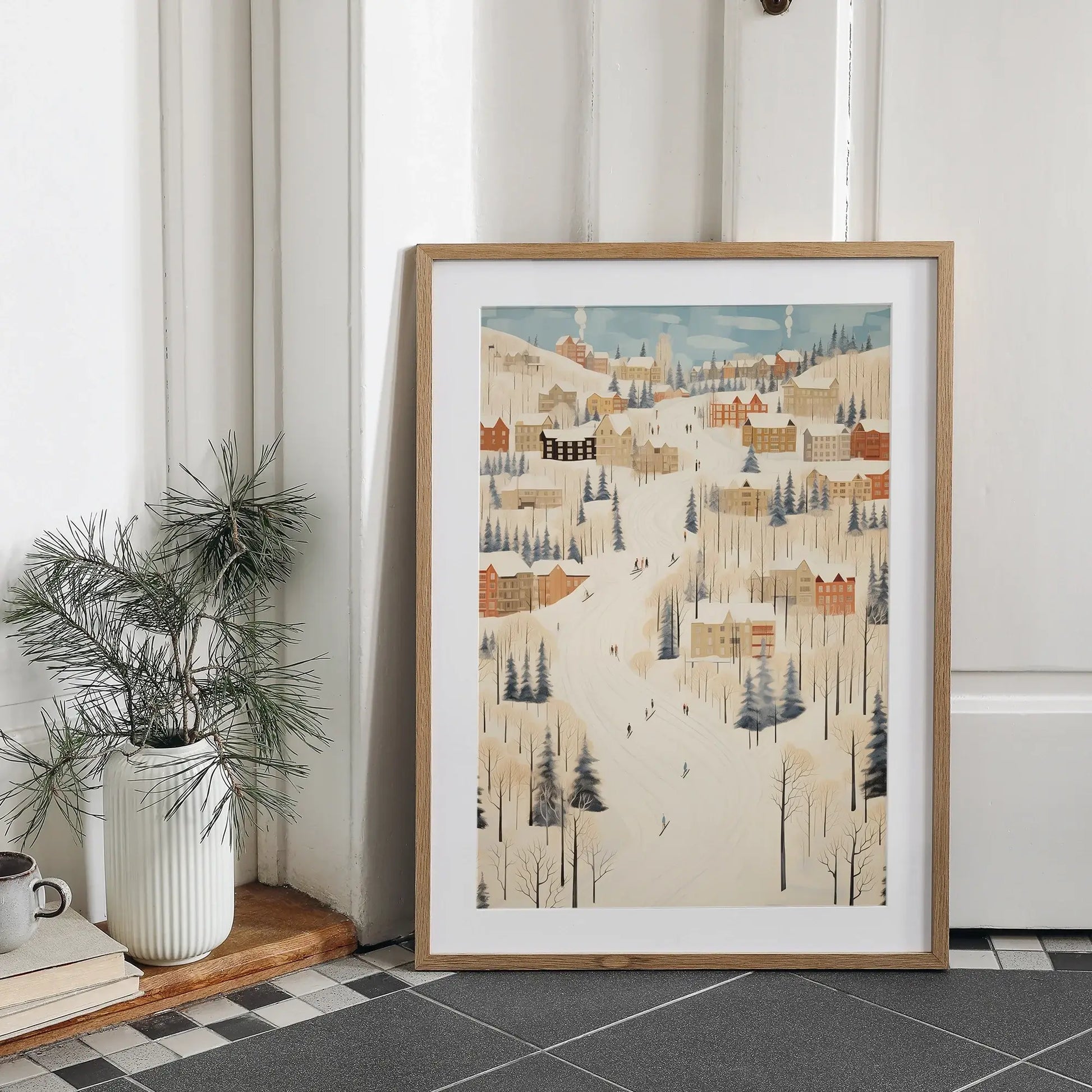 Christmas wall art prints featuring a winter village scene with snow and cozy homes.