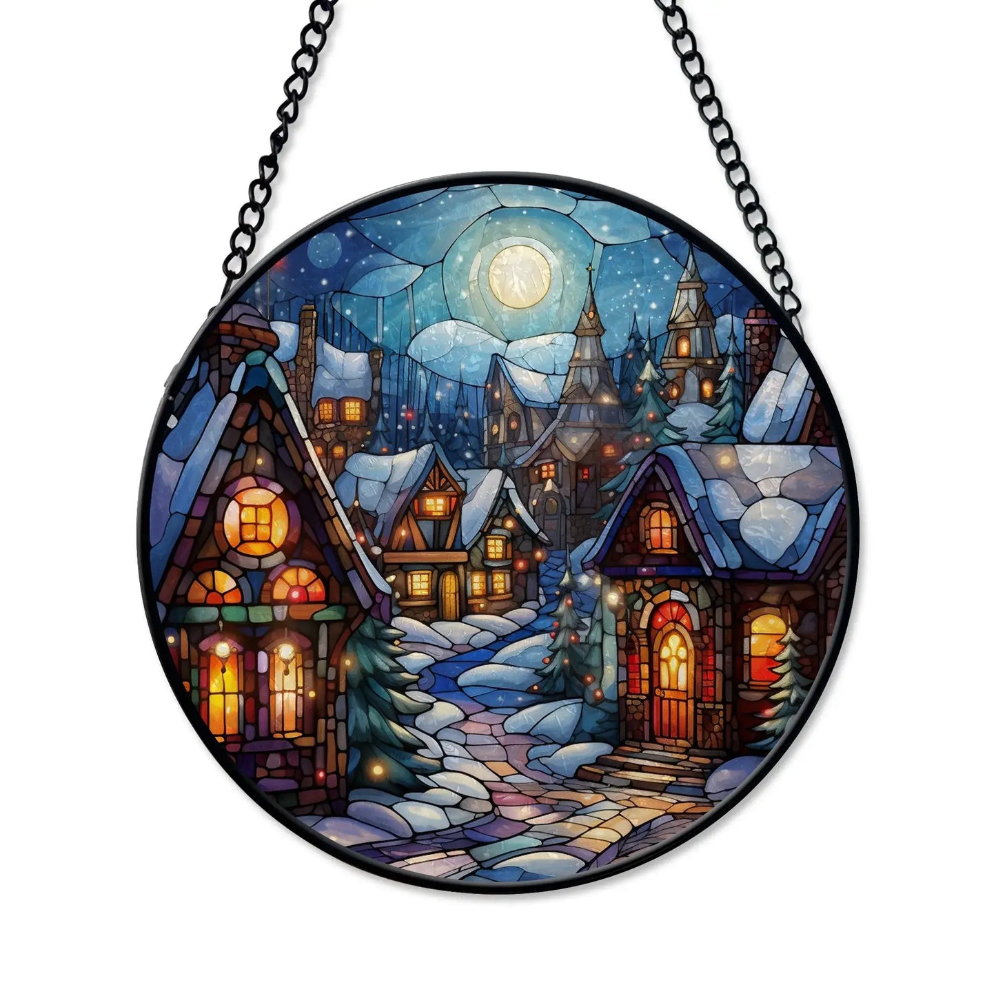 Winter village stained glass ornament featuring a snowy village scene with glowing windows and a full moon.
