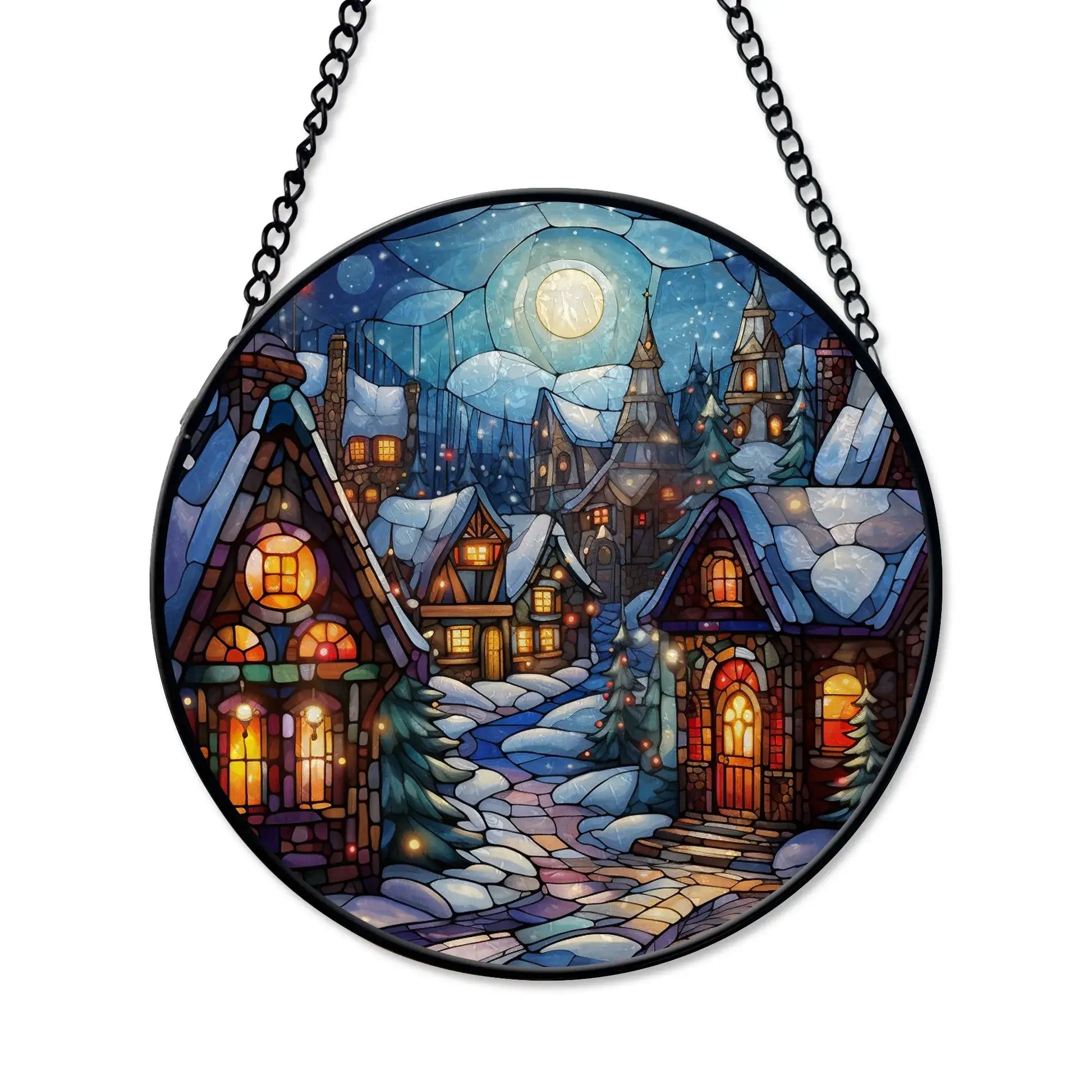 Winter village stained glass ornament featuring a snowy village scene with glowing windows and a full moon.