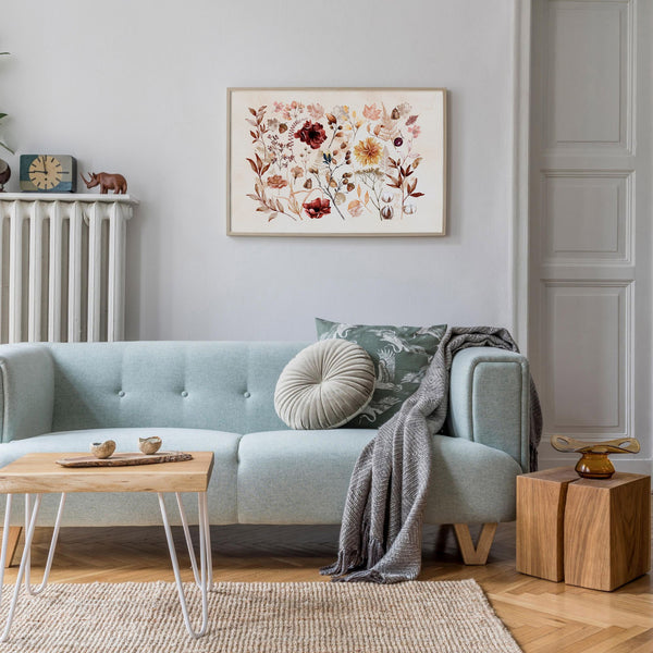 cozy living room with blue sofa and Fall wildflowers wall art from Blue Water Songs