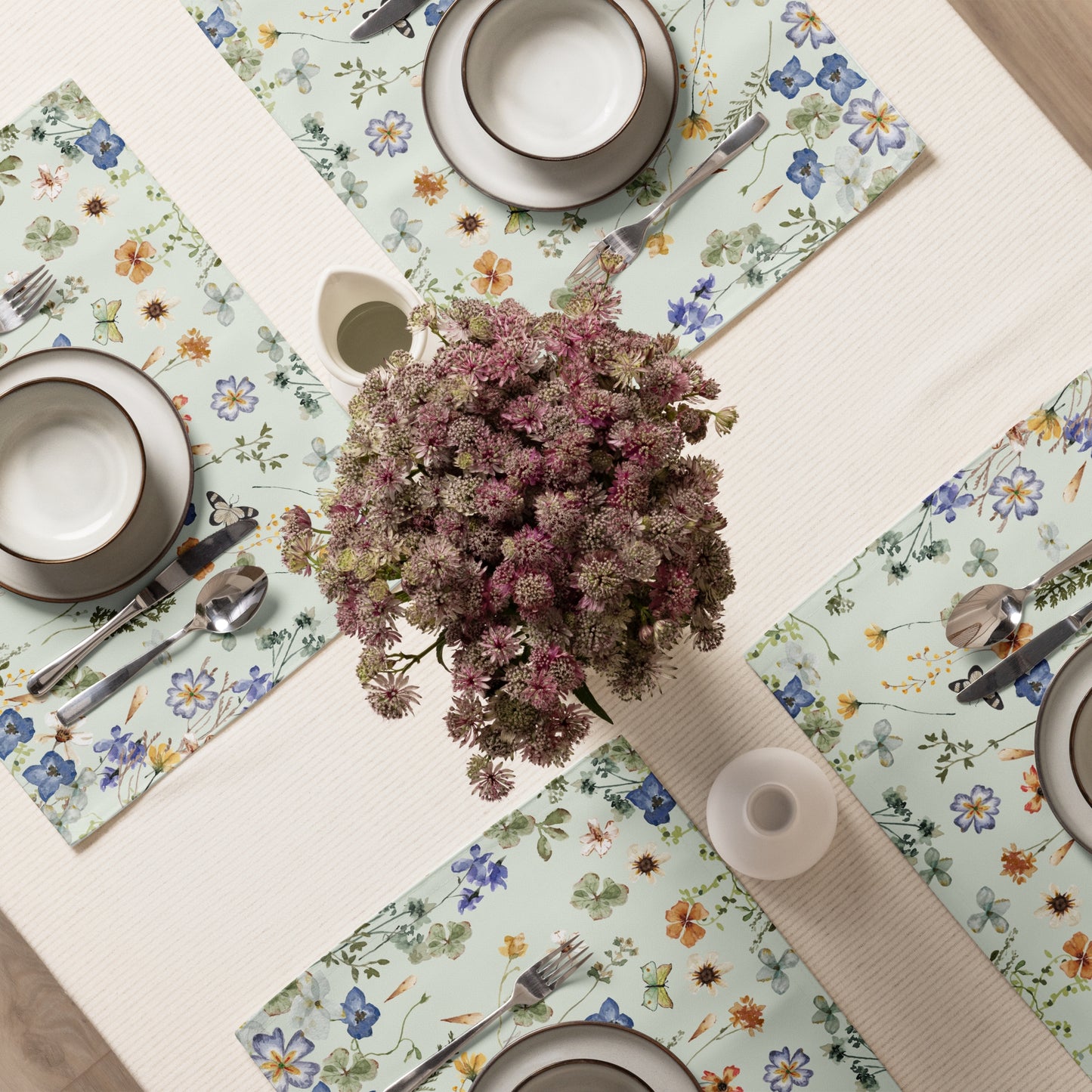 dinning setting with green flower places and plates on table