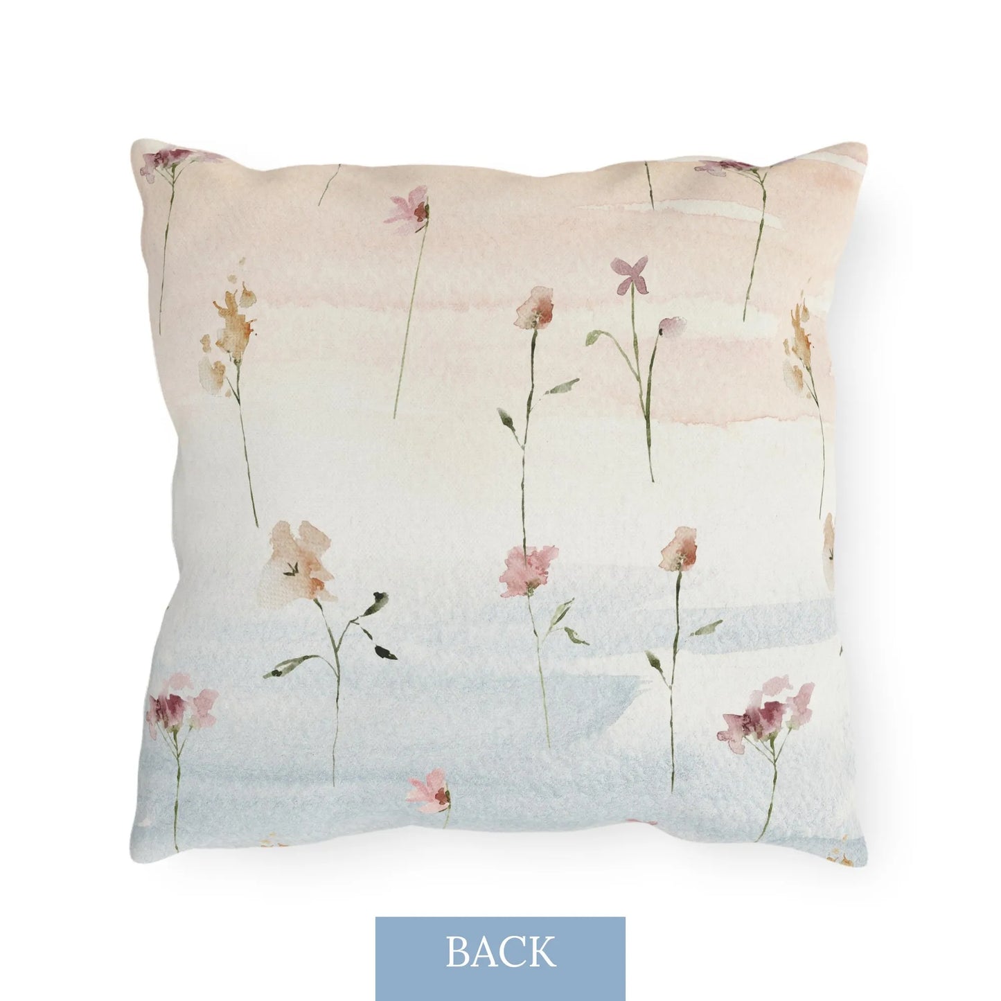 Back side of the floral outdoor pillow with blue and yellow wildflowers and butterflies