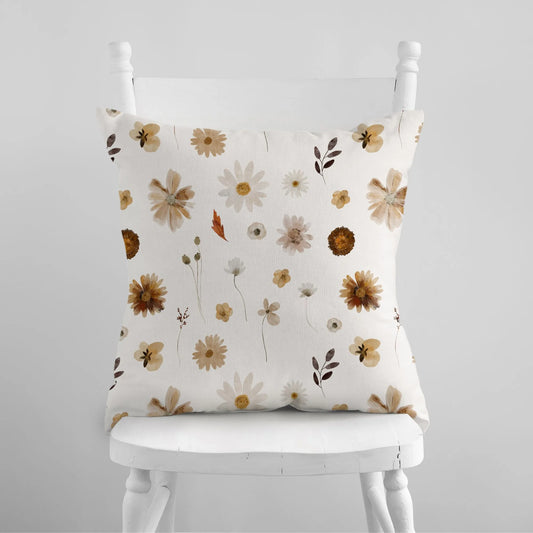 white chair and Watercolor Fall Wildflowers PILLOW from Blue Water Songs on it