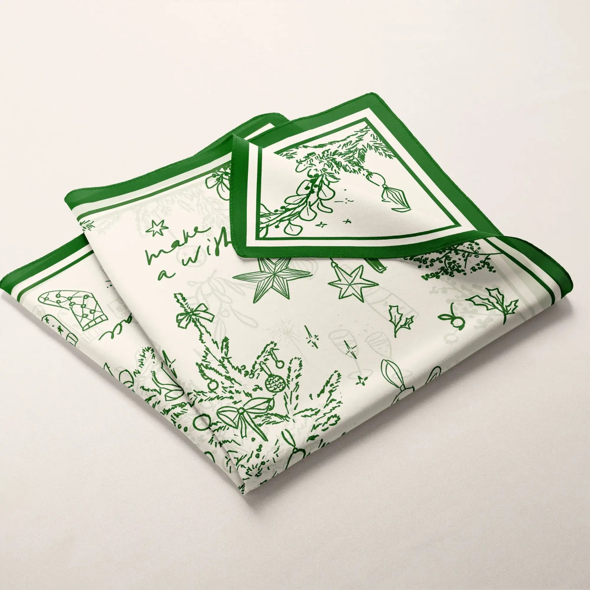 Green Christmas Silk Scarf folded neatly — a festive, elegant gift inspired by the magic of the holidays.