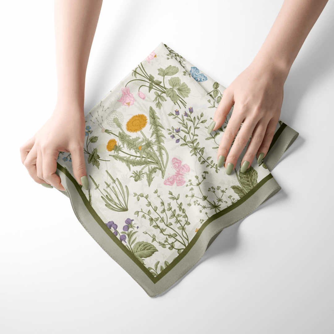 woman' hands holding green silk scraf