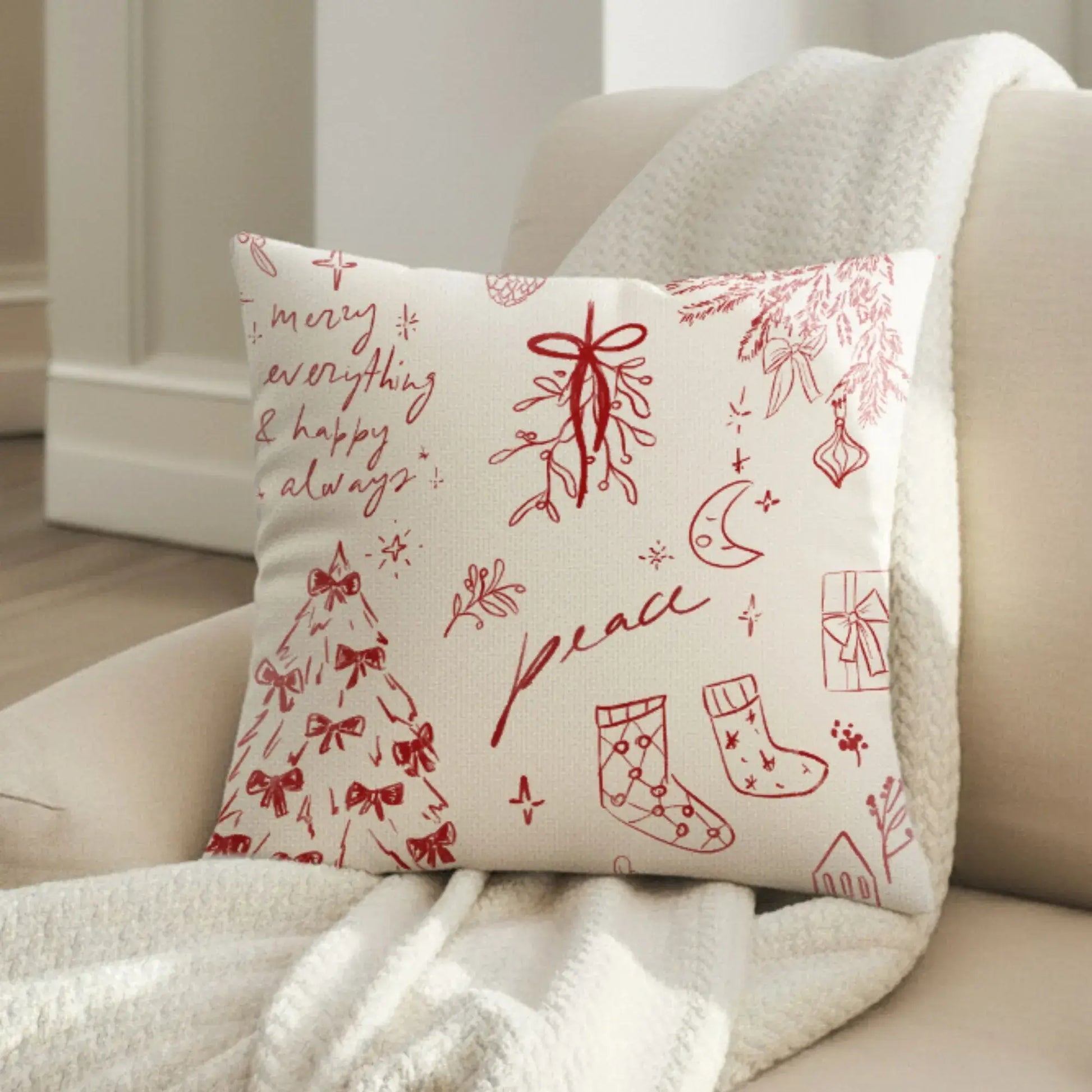 Hand-Drawn Christmas Pillow featuring holiday designs like mistletoe, stockings, and the words peace and merry everything.
