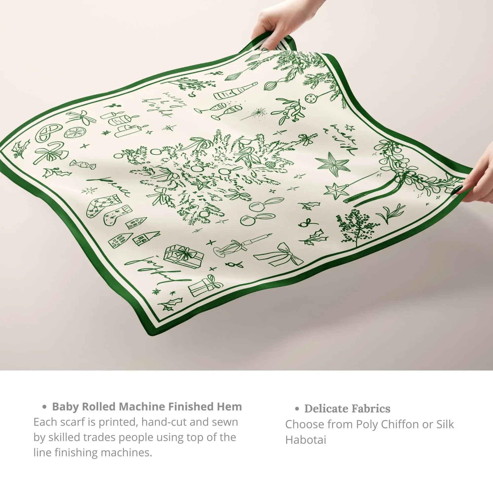 Green Christmas Silk Scarf held by hands, showing its soft drape and smooth texture.