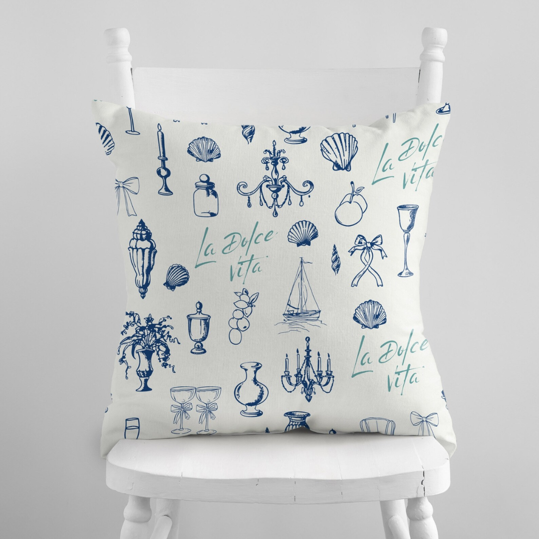 La Dolce Vita pillow on white chair — nature-inspired summer home decor
