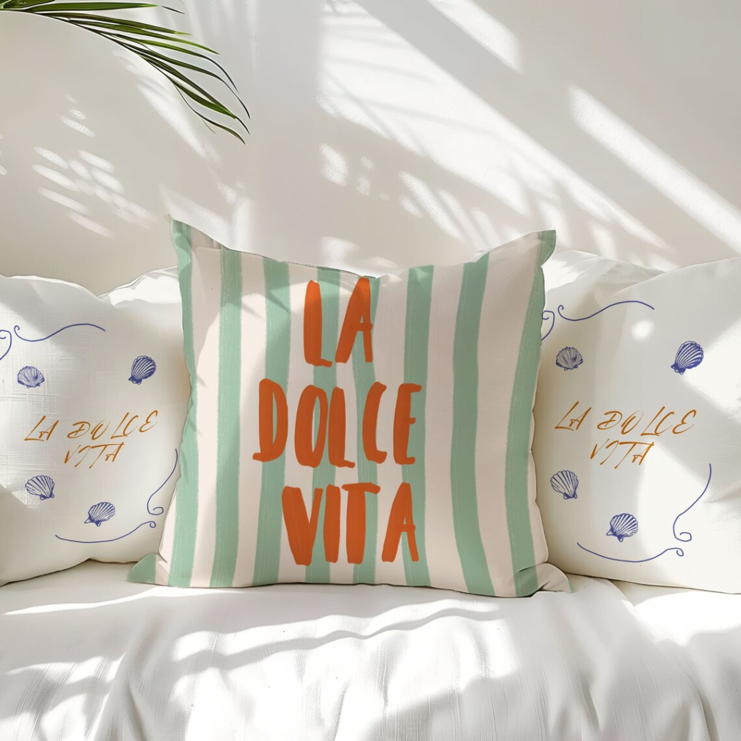 3 La Dolce vita pillows on white couch