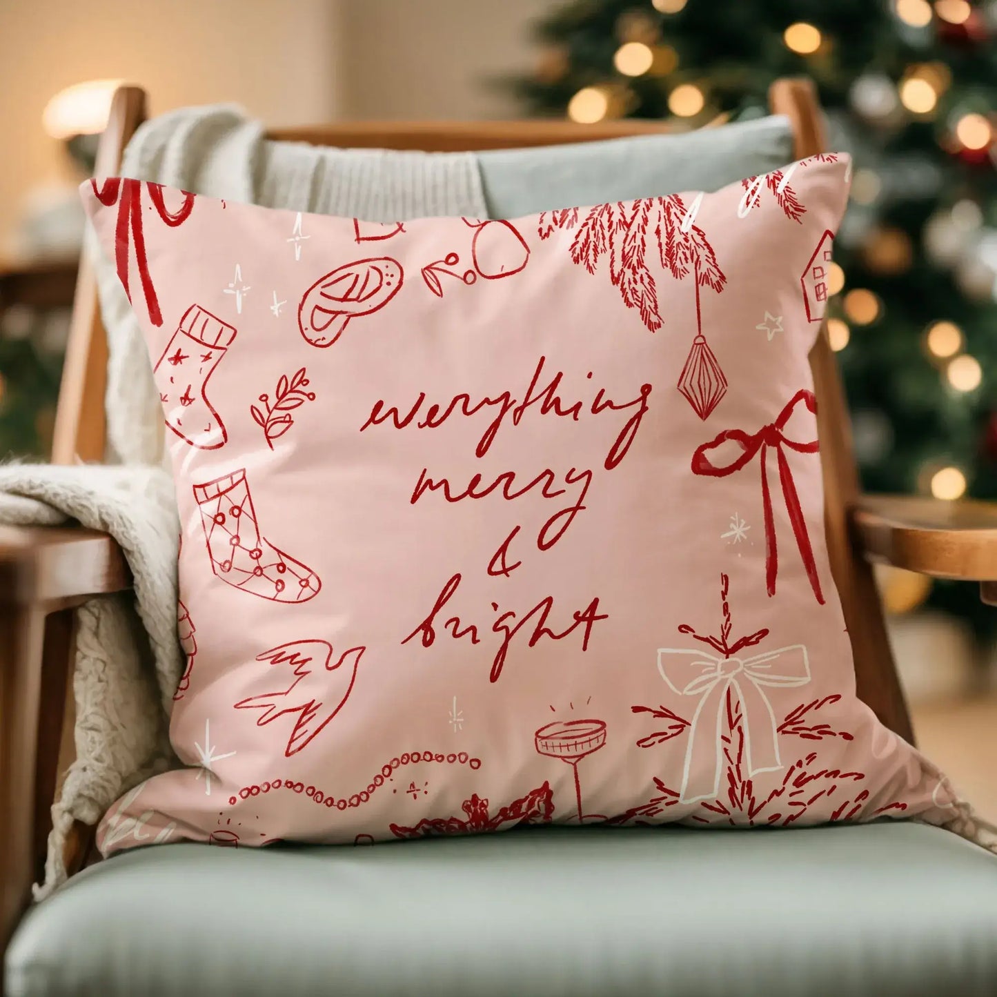 Merry and Bright Christmas Pillow Cover featuring whimsical sketches of holiday elements on a cozy chair.