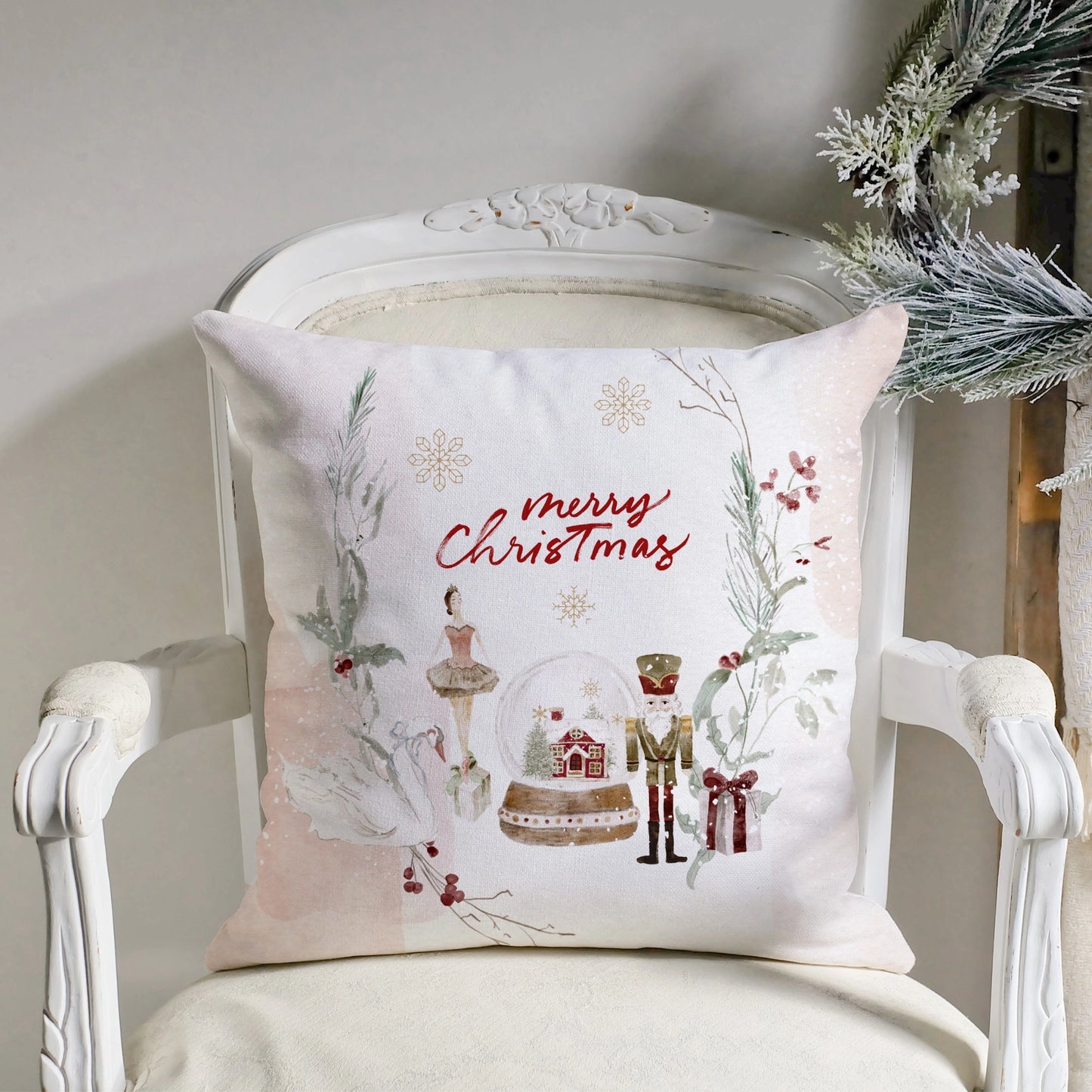 Ballet Christmas Pillow Cover featuring watercolor nutcracker design and holiday elements on a decorative chair.