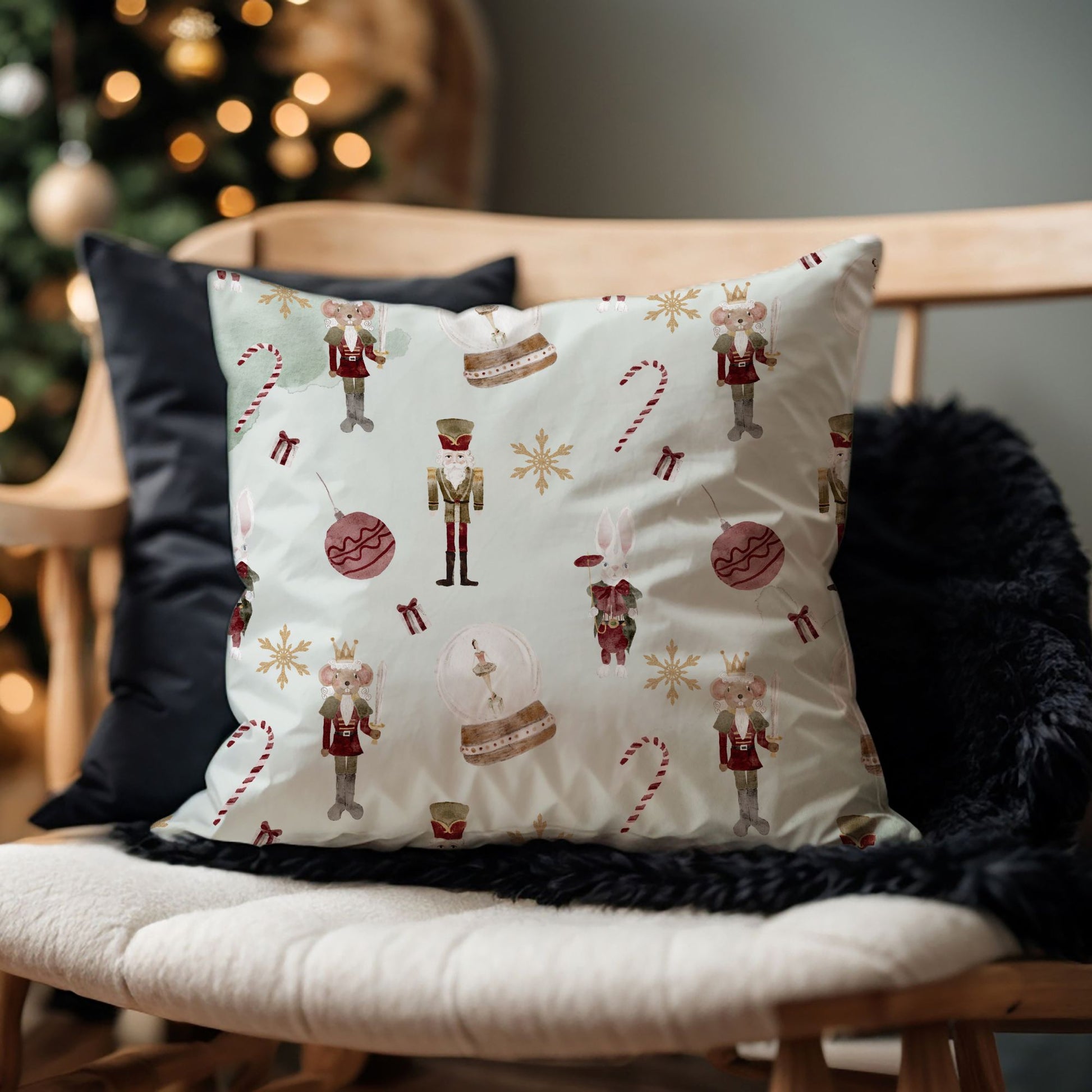 Pastel Nutcracker Christmas PILLOW featuring whimsical ballerina and Nutcracker designs on a cozy sofa.