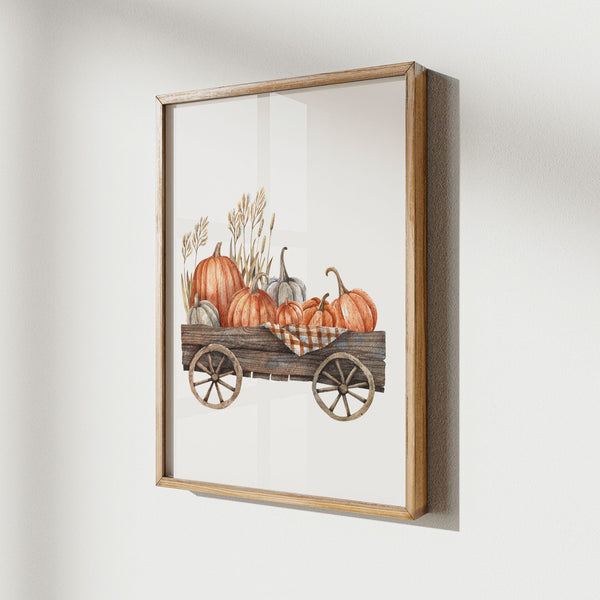 Pumpkin cart painting from Blue Water Songs hanging on white wall