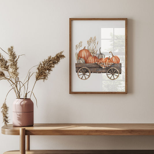 Pumpkin cart painting from Blue Water Songs hanging on white wall