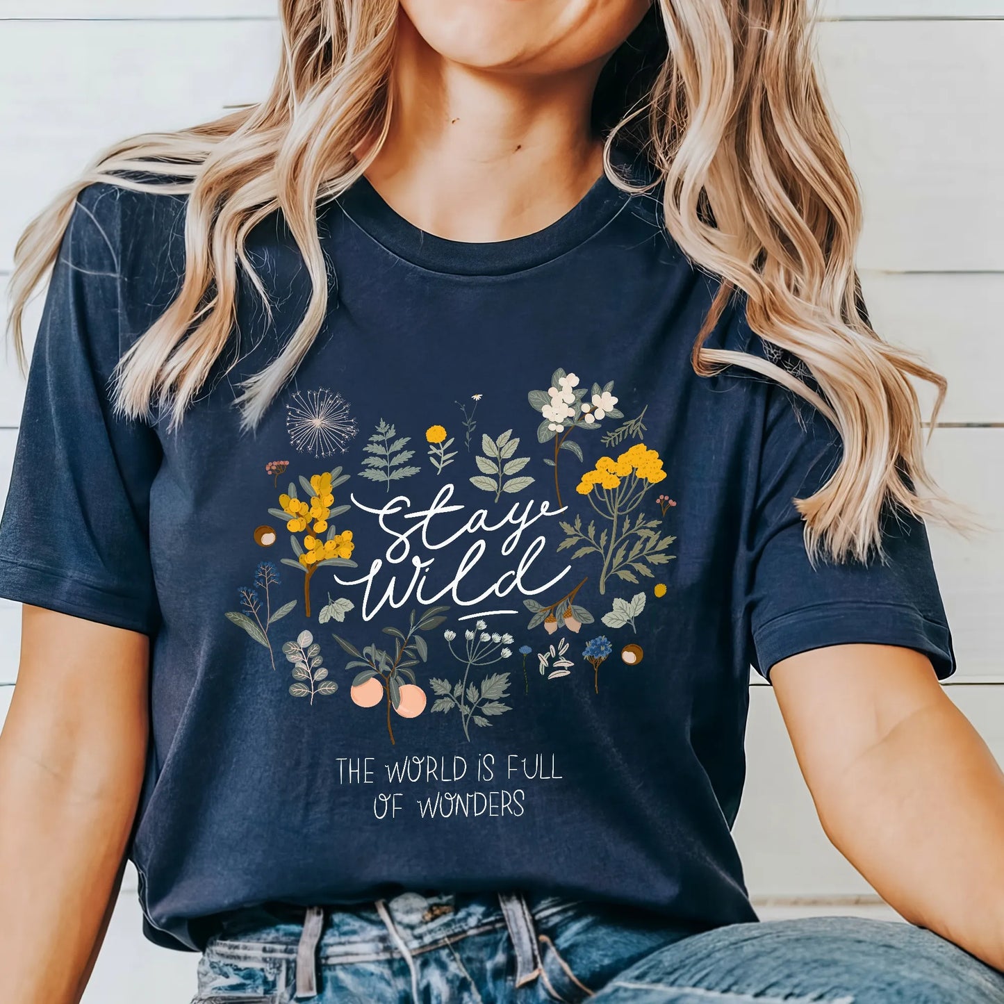 woman in 'Stay wild' Navy T-SHIRT from Blue Water Songs