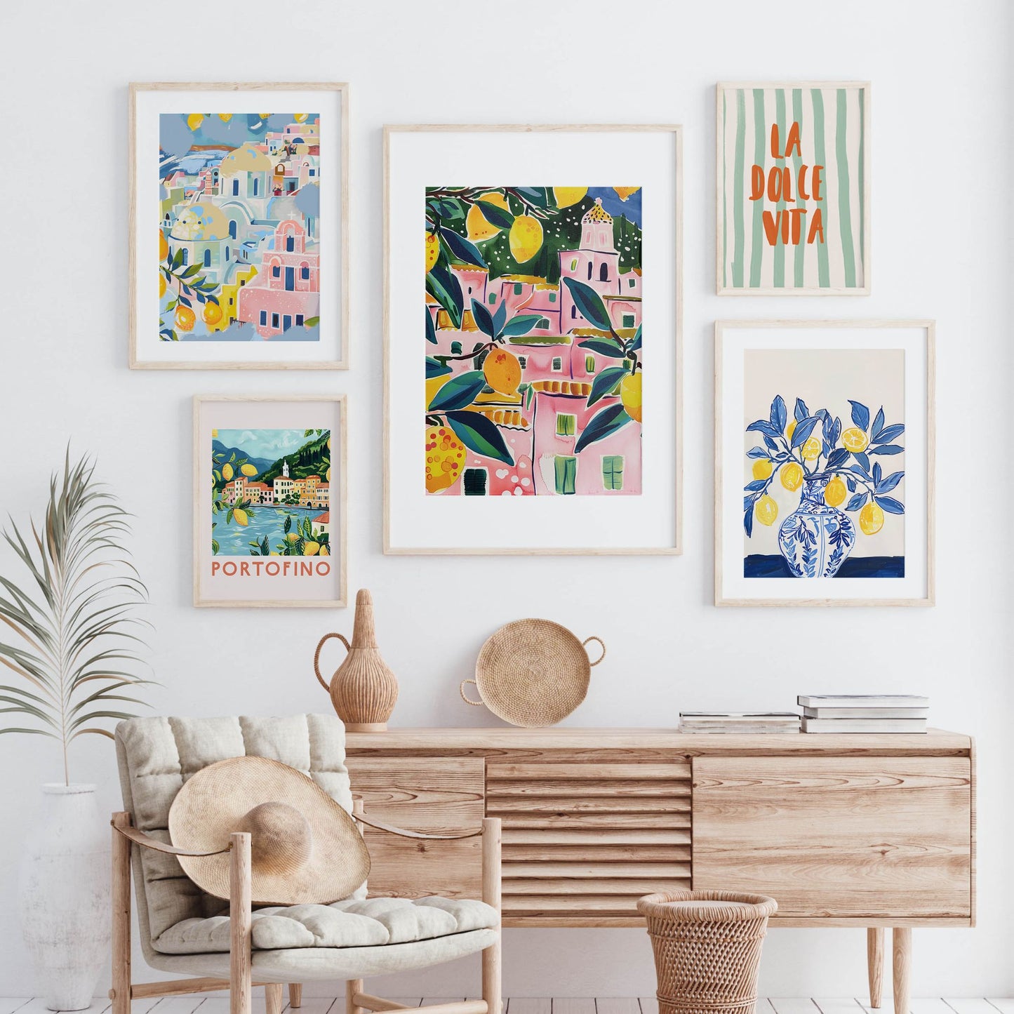 Framed Mediterranean gallery wall with 5 colorful digital art prints including lemons, coastal towns, and Portofino print