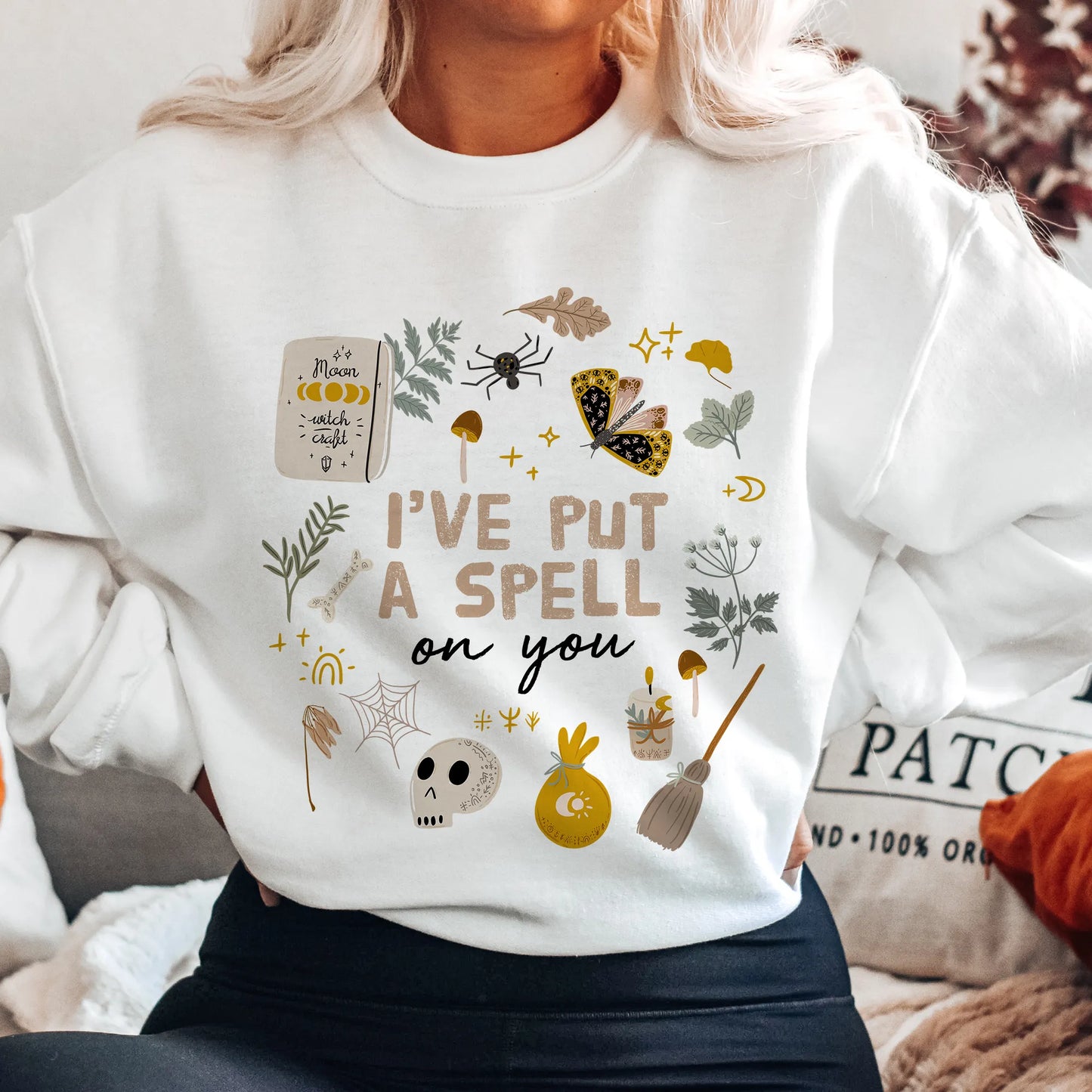 blond girl in 'I put a spell on you' Botanical Witch SWEATSHIRT from Blue Water Songs