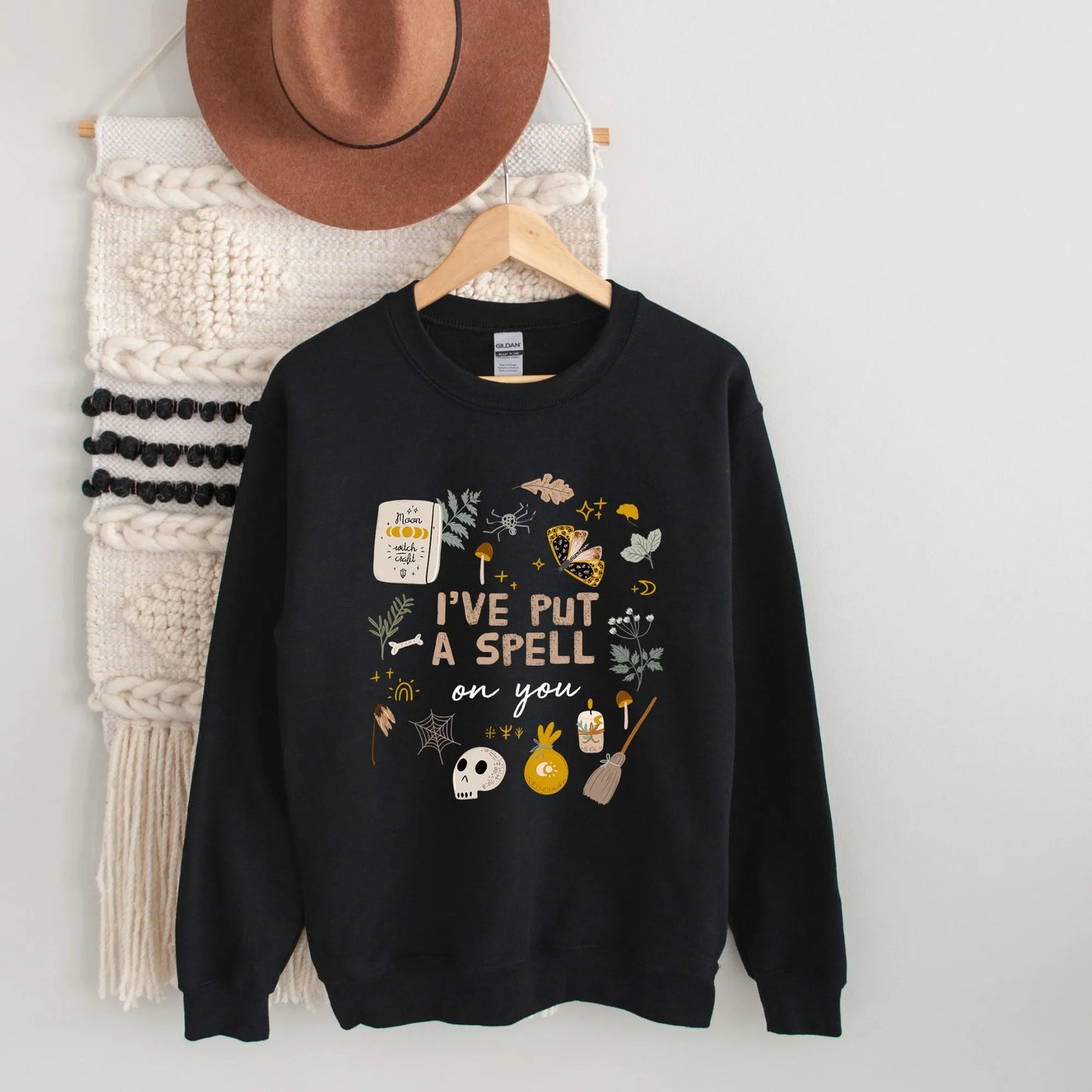 'I put a spell on you' Botanical Witch SWEATSHIRT hanging on wall