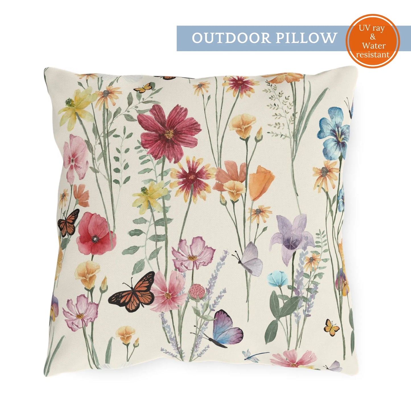 Square outdoor pillow featuring colorful watercolor wildflowers and butterflies on cream background, labeled UV ray & water resistant.