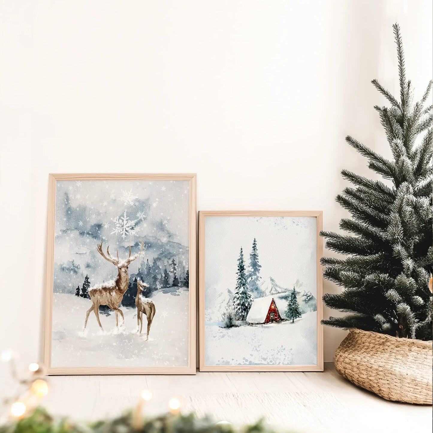 Winter Wonderland Prints Set of 5 featuring framed artwork of deer and a cozy cottage surrounded by snow.