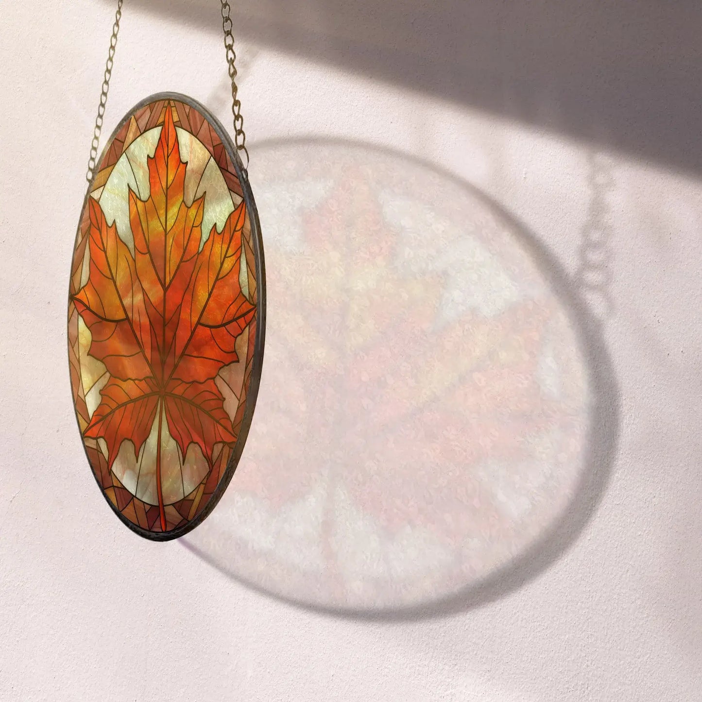 reflection of Fall Leaves Round Stained Glass Ornament on the wall