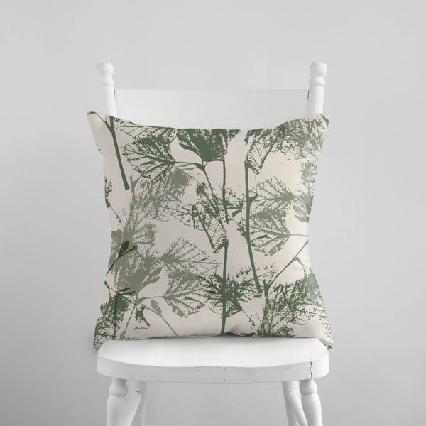 Birch Leaves Herbarium green PILLOW from Blue Water Songs on white chair