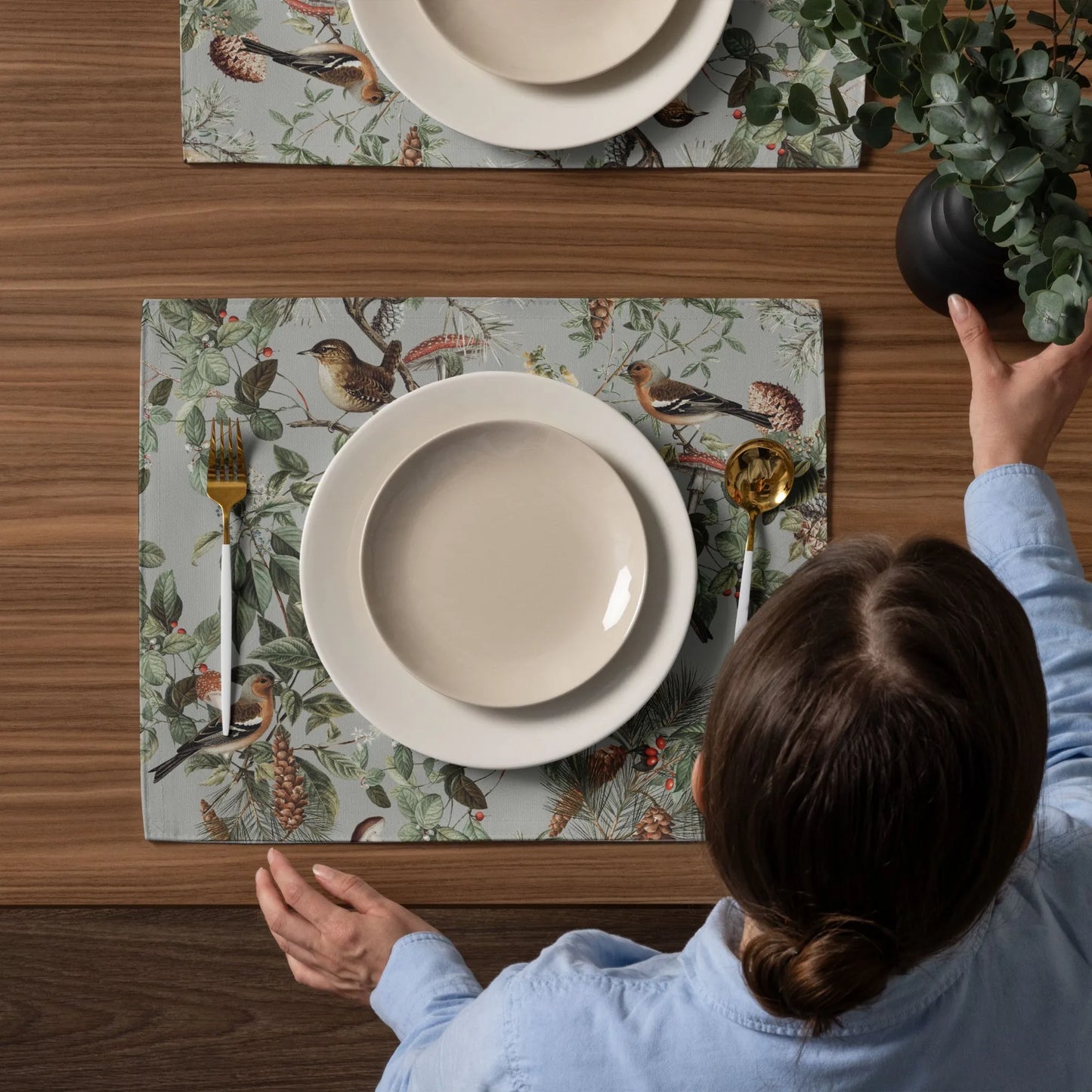 woman setting up dining table with Vintage Autumn Botanical PLACEMATS from Blue Water Songs