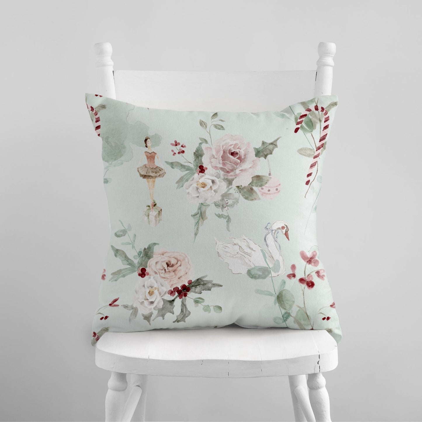 Ballerina Christmas Pillow Cover with floral design on a white chair, perfect for winter decor.