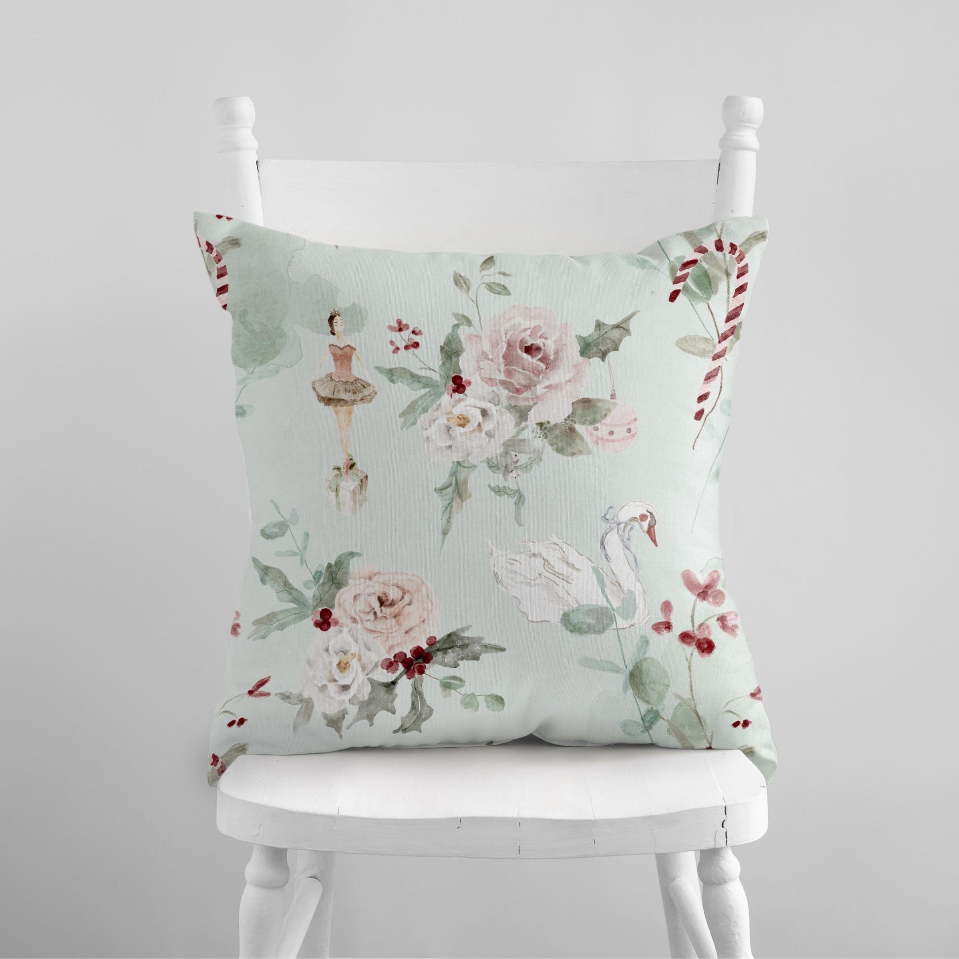 Ballerina Christmas Pillow Cover with floral design on a white chair, perfect for winter decor.
