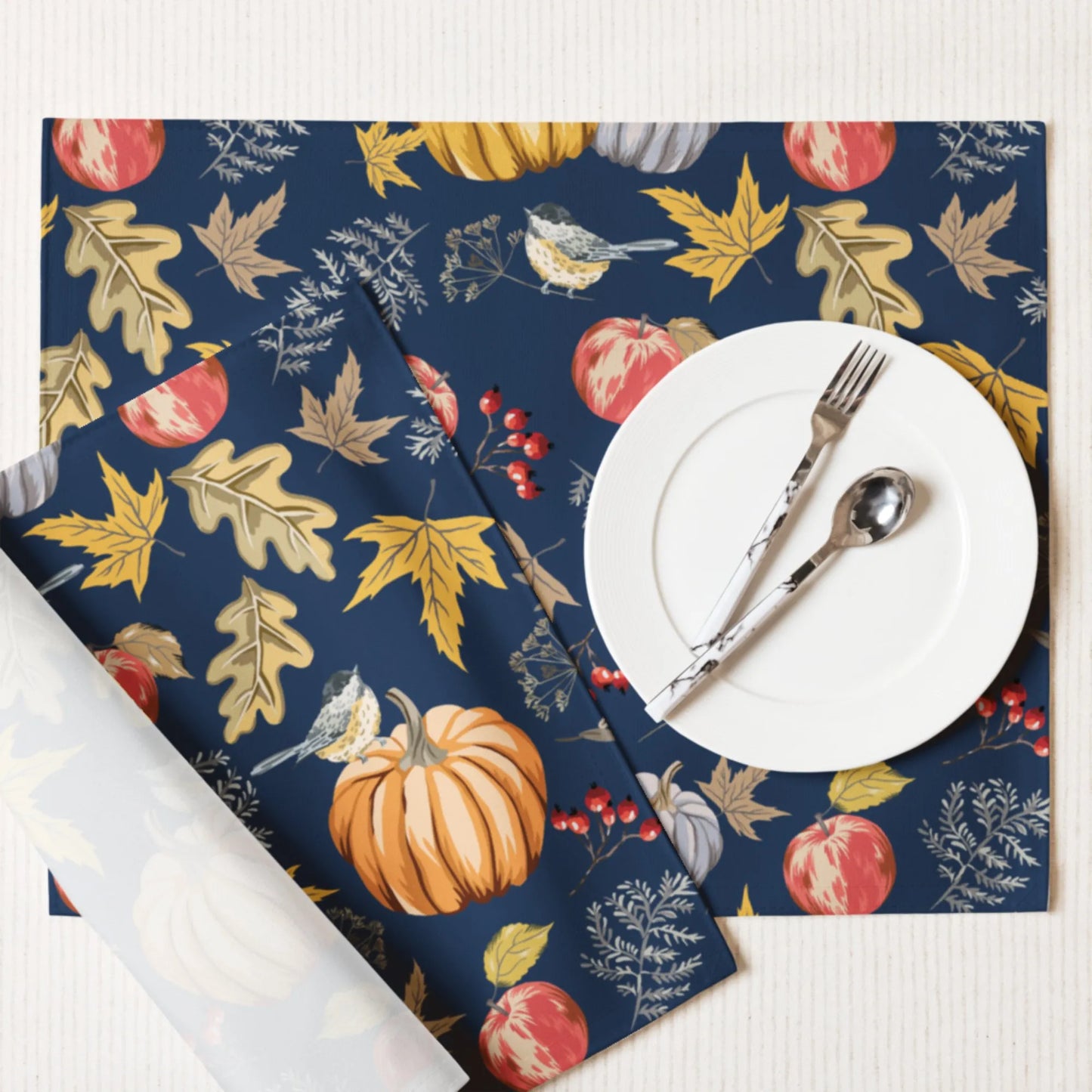 Pumpkin and bird PLACEMATS from Blue Water Songs with white plate on it