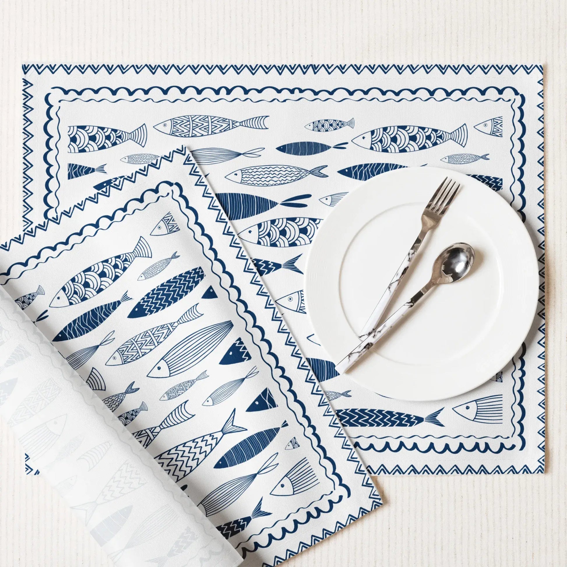 Blue Fish Cotton Placemats with hand-drawn fish designs, perfect for coastal dining and nautical decor.