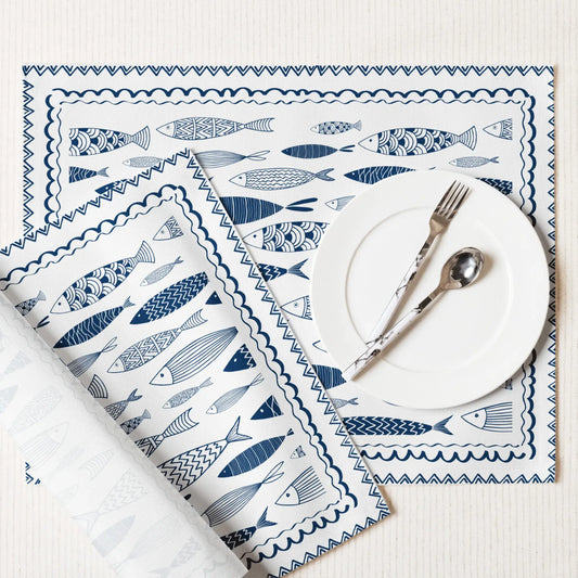 Blue Fish Cotton Placemats with hand-drawn fish designs, perfect for coastal dining and nautical decor.